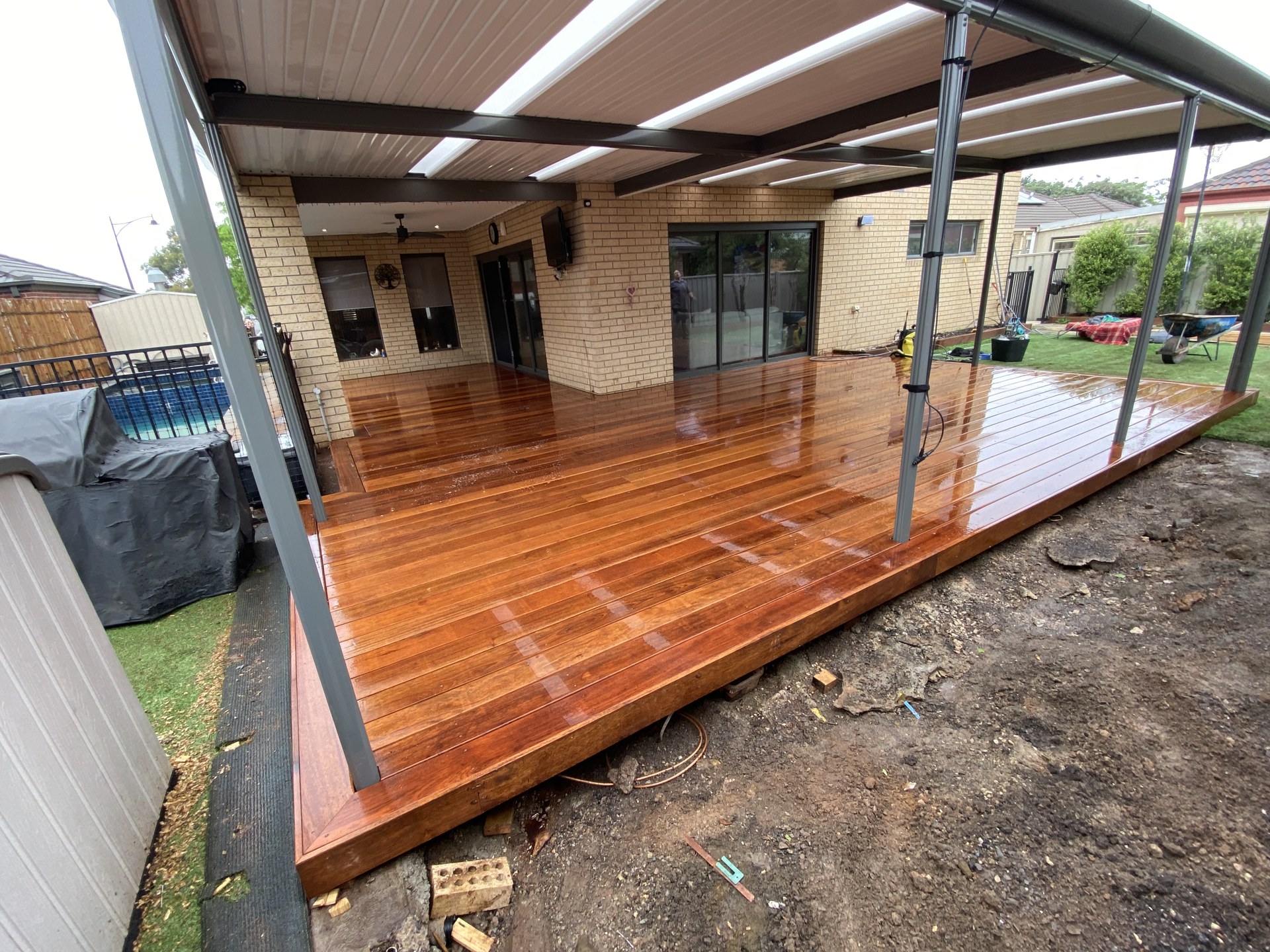 Covered outdoor entertainer with timber decking